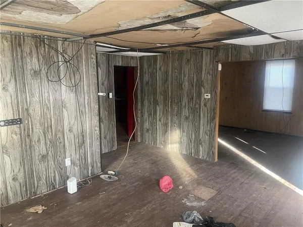 a view of a room with a wooden door
