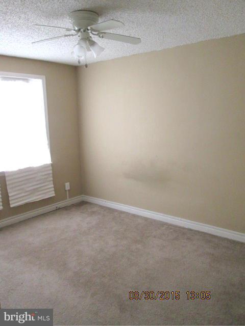 1233 Silverthorne Road Baltimore, MD 21239 - Photo 8 of 13 a view of an empty room