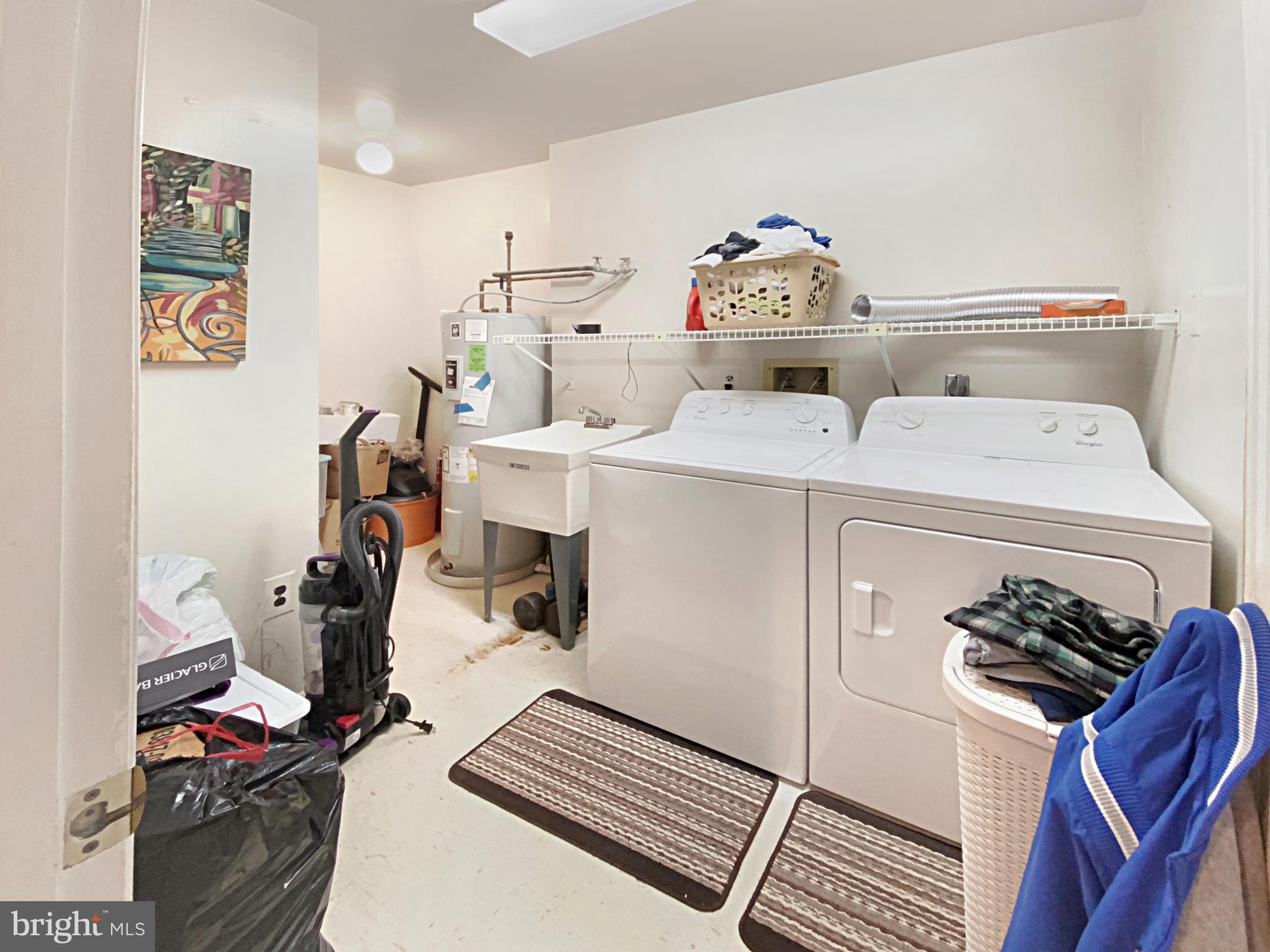 3021 Fallstaff Road, Unit 403B Baltimore, MD 21209 - Photo 40 of 44 Full laundry room with utility sink.