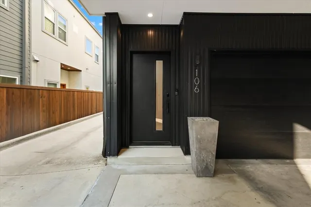 a view of a kitchen with a sink and cabinets