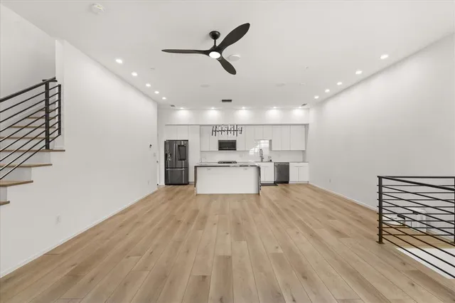 a view of a kitchen and a sink wooden floor