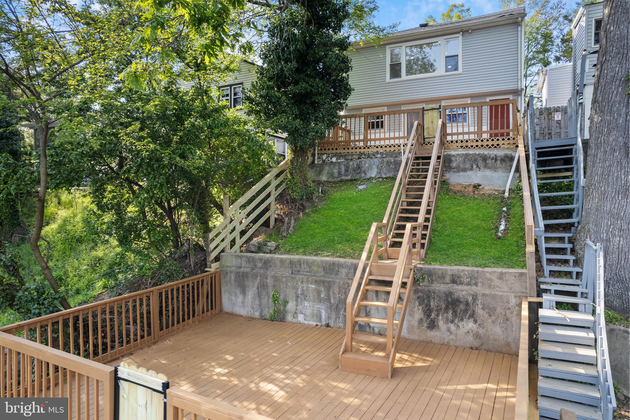 a view of a backyard with a deck