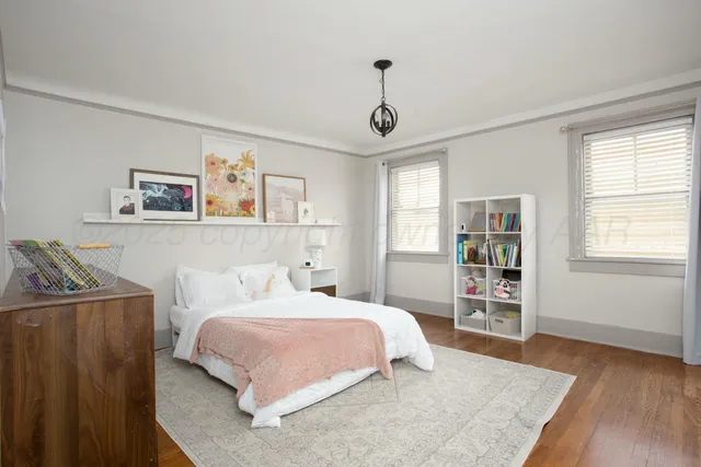 a spacious bedroom with a bed and a walk in closet