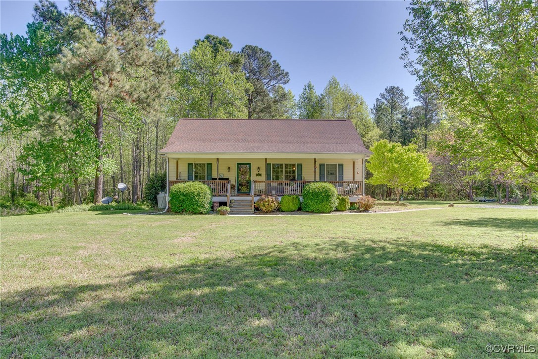 3875 Wakema Road West Point, VA 23181 - Photo 1 of 45 a front view of a house with a yard