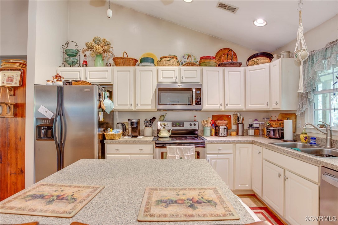 3875 Wakema Road West Point, VA 23181 - Photo 17 of 45 a kitchen with stainless steel appliances granite countertop a refrigerator a stove and a sink