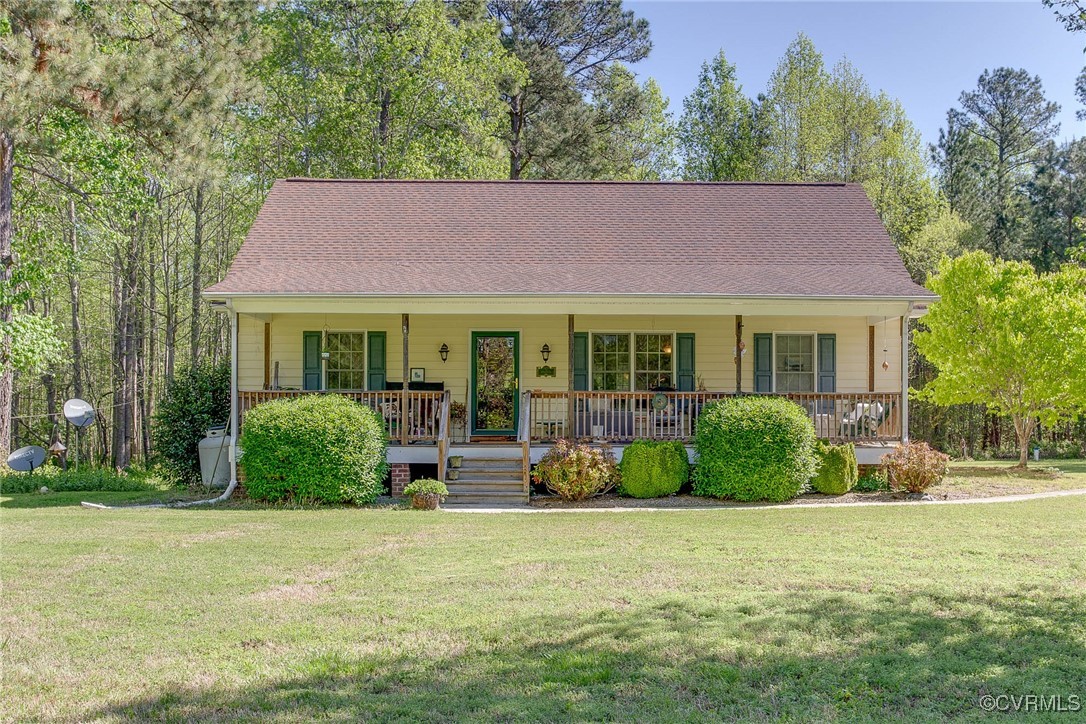 3875 Wakema Road West Point, VA 23181 - Photo 2 of 45 a view of a house with a garden