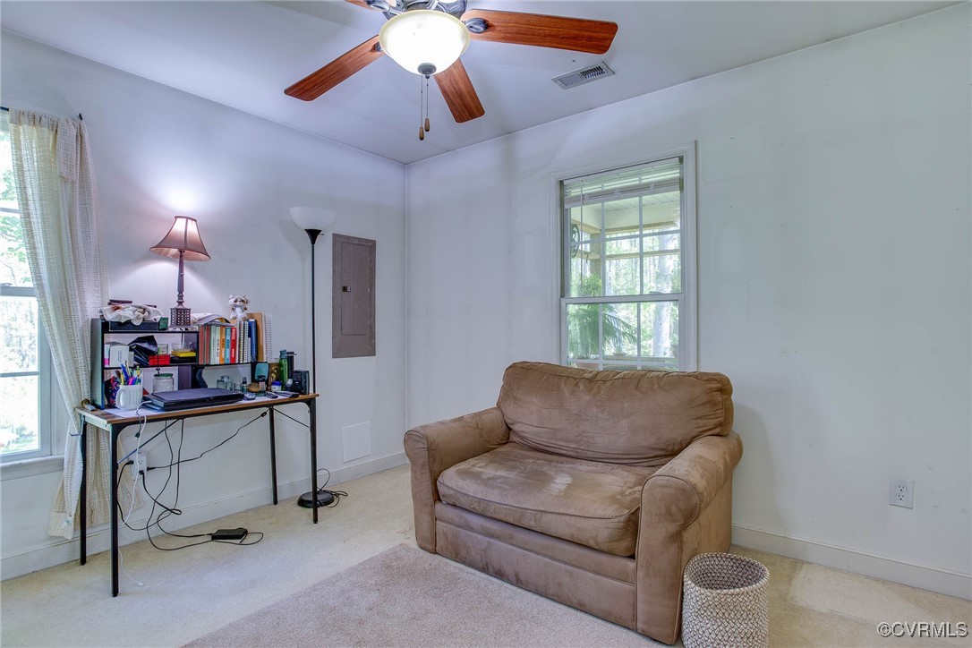 3875 Wakema Road West Point, VA 23181 - Photo 28 of 45 a living room with furniture a ceiling fan and a window