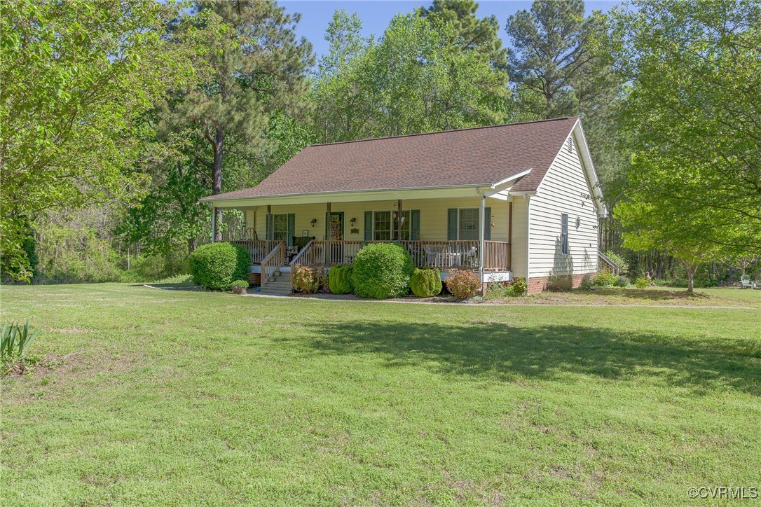 3875 Wakema Road West Point, VA 23181 - Photo 3 of 45 a front view of a house with garden