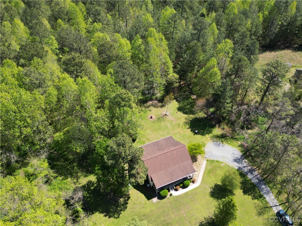 3875 Wakema Road West Point, VA 23181 - Photo 35 of 45 an aerial view of a house with swimming pool and red chairs