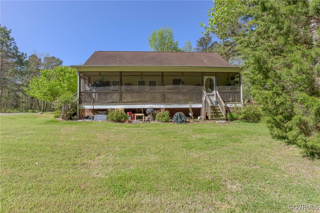 3875 Wakema Road West Point, VA 23181 - Photo 10 of 45 a front view of a house with a garden
