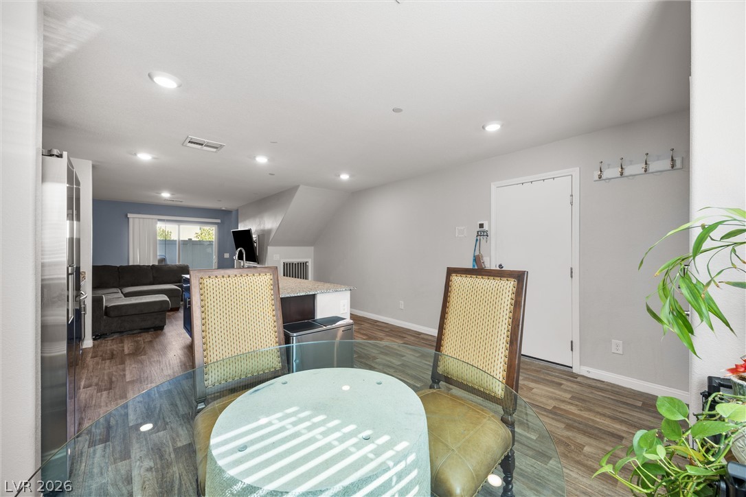 12240 Golden Wreath Road, Unit 2 Las Vegas, NV 89183 - Photo 29 of 29 An open floorplan seamlessly connects the dining area to the kitchen and living room.