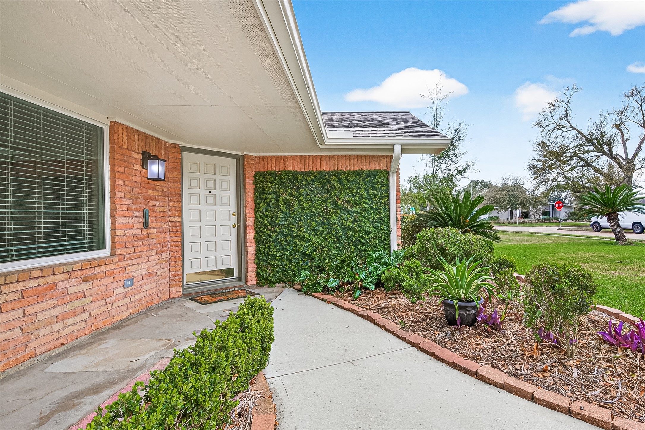1506 Foxwood Road Houston, TX 77008 - Photo 4 of 44 The front entrance is a welcoming site with a manicured creeping ivy wall, lush green hedges and plants, and a covered porch to sit on, rain or shine.