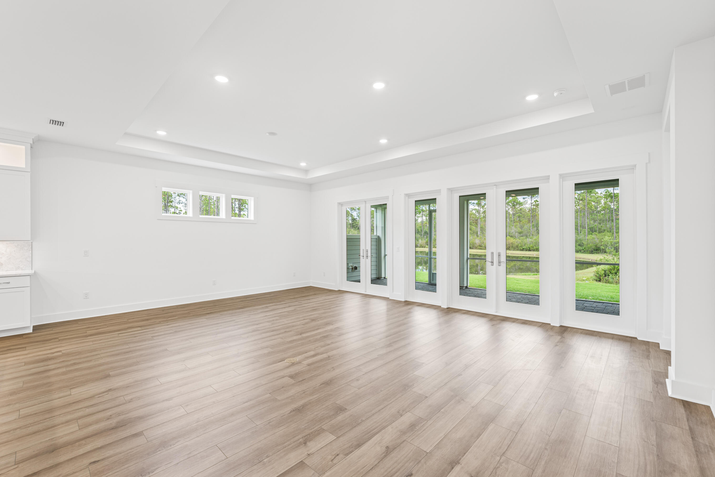 169 Orman Ct Inlet Beach Inlet Beach, FL 32461 - Photo 11 of 23 a view of an empty room with wooden floor and a window