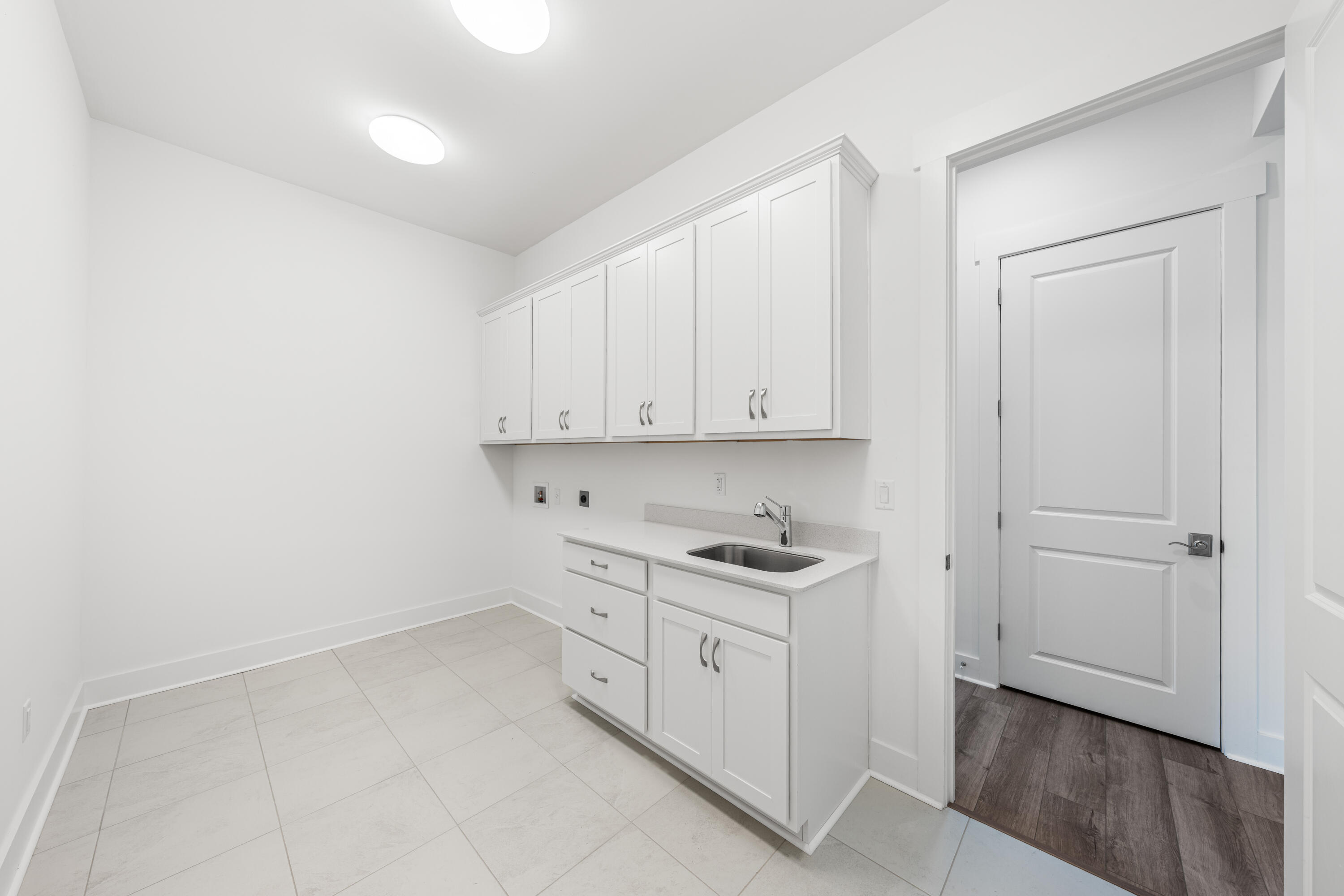 169 Orman Ct Inlet Beach Inlet Beach, FL 32461 - Photo 20 of 23 a kitchen with white cabinets and white appliances