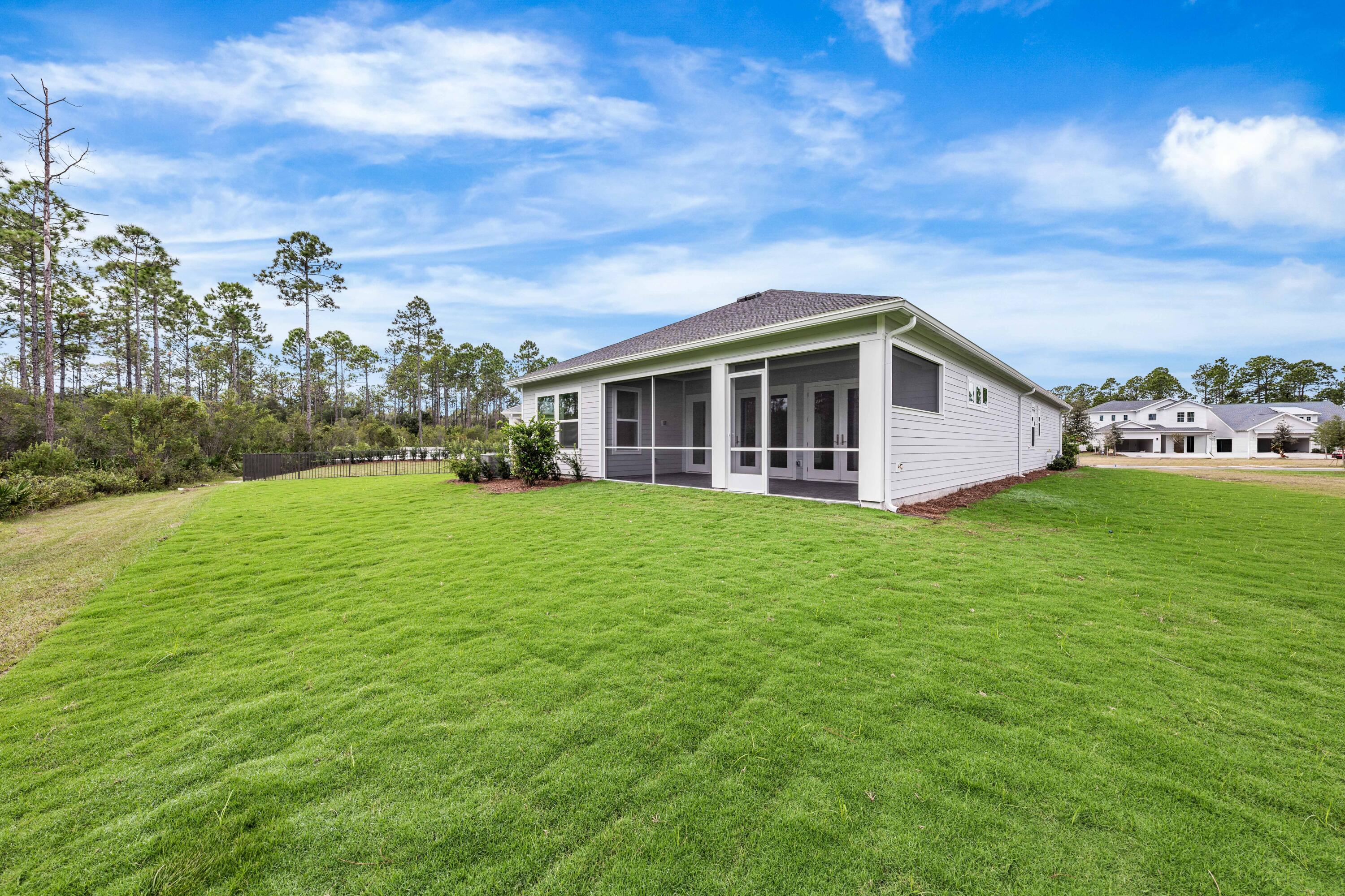 169 Orman Ct Inlet Beach Inlet Beach, FL 32461 - Photo 22 of 23 a view of a house with a yard