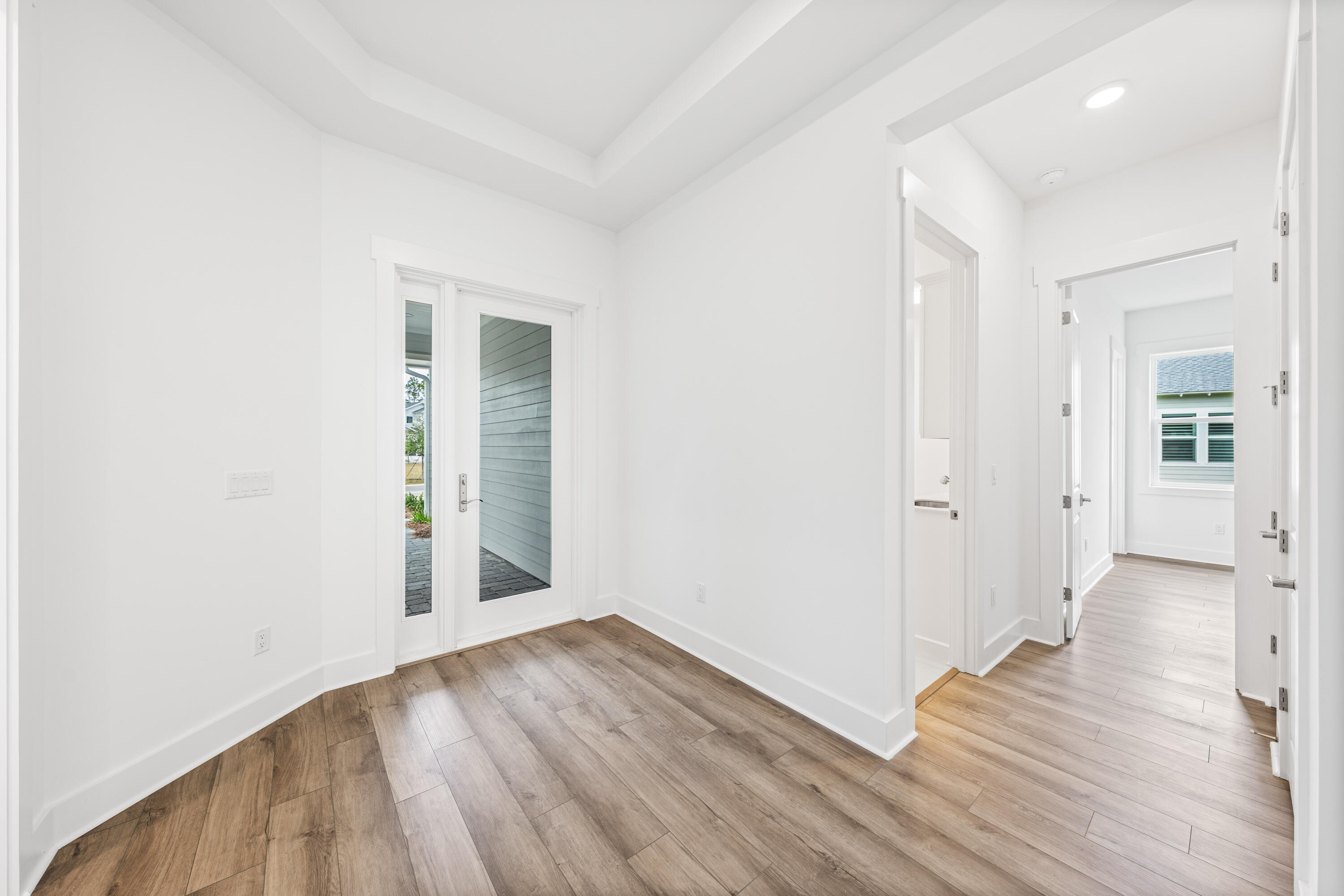 169 Orman Ct Inlet Beach Inlet Beach, FL 32461 - Photo 5 of 23 an empty room with wooden floor and windows