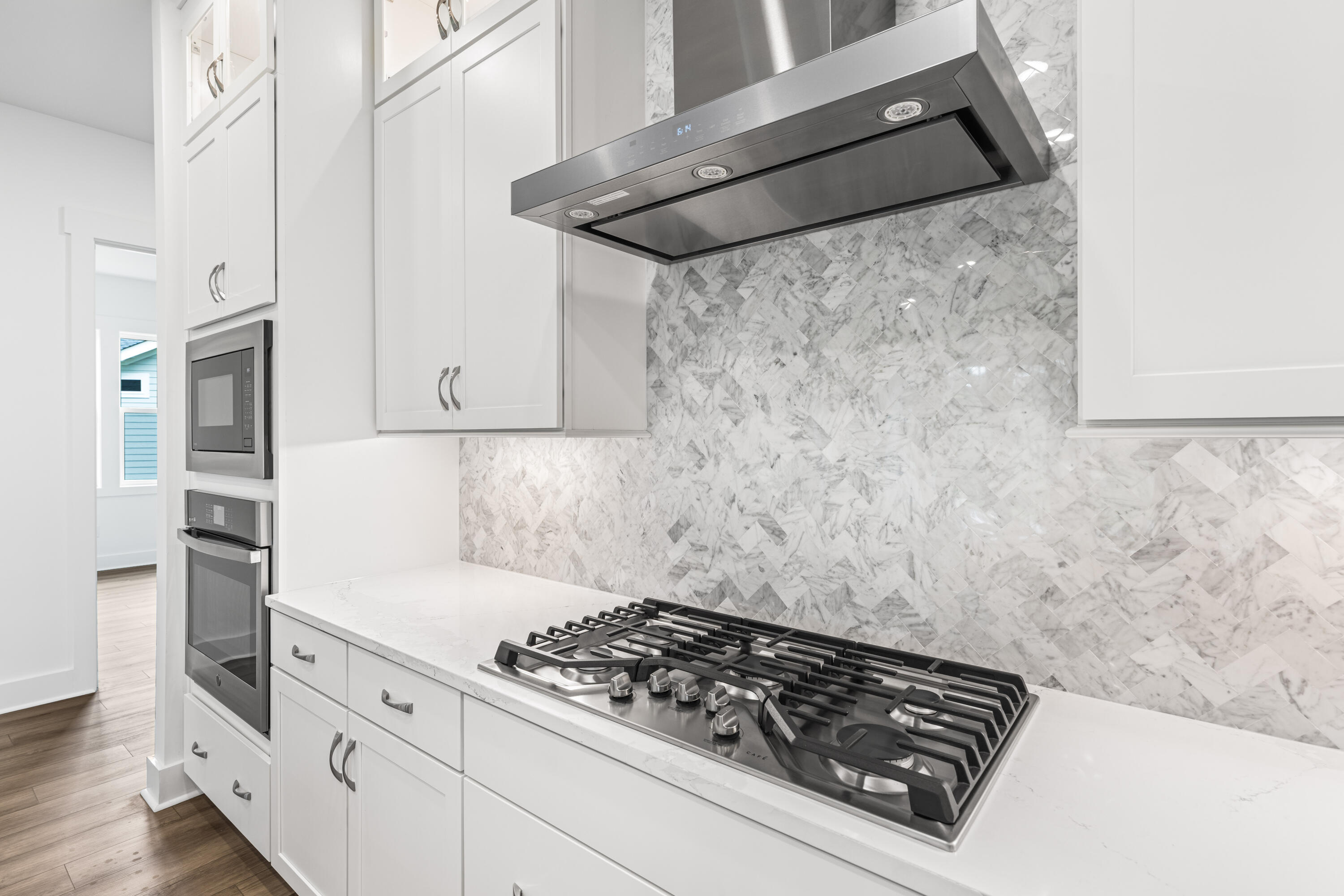 169 Orman Ct Inlet Beach Inlet Beach, FL 32461 - Photo 8 of 23 a kitchen with white cabinets and appliances