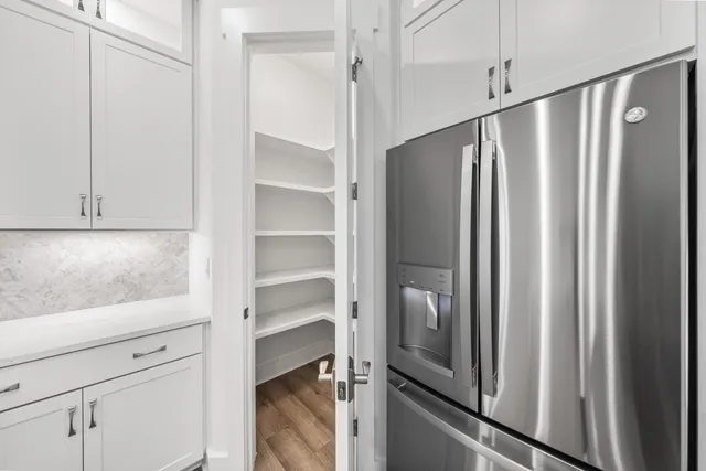 a view of a refrigerator and window in a kitchen
