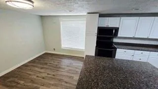 a view of a kitchen with a sink