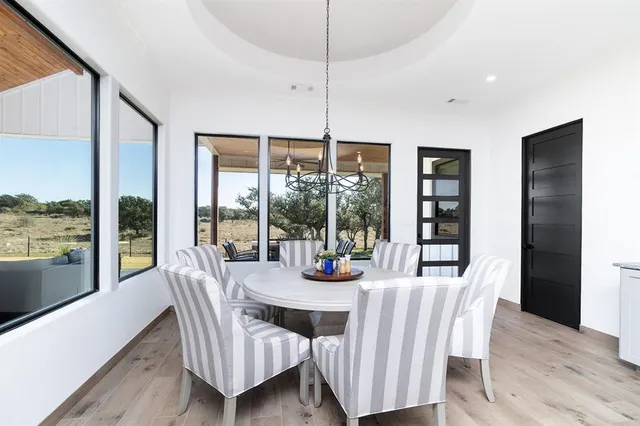 a living room with a fireplace and a flat screen tv