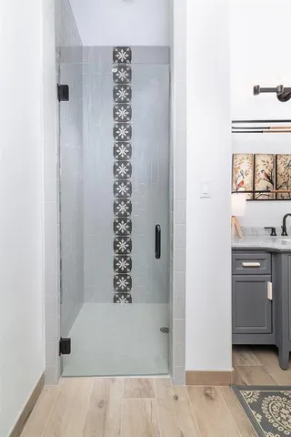 a spacious bathroom with a toilet sink and mirror