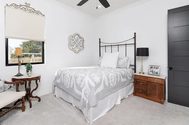 a bathroom with a granite countertop sink mirror and vanity
