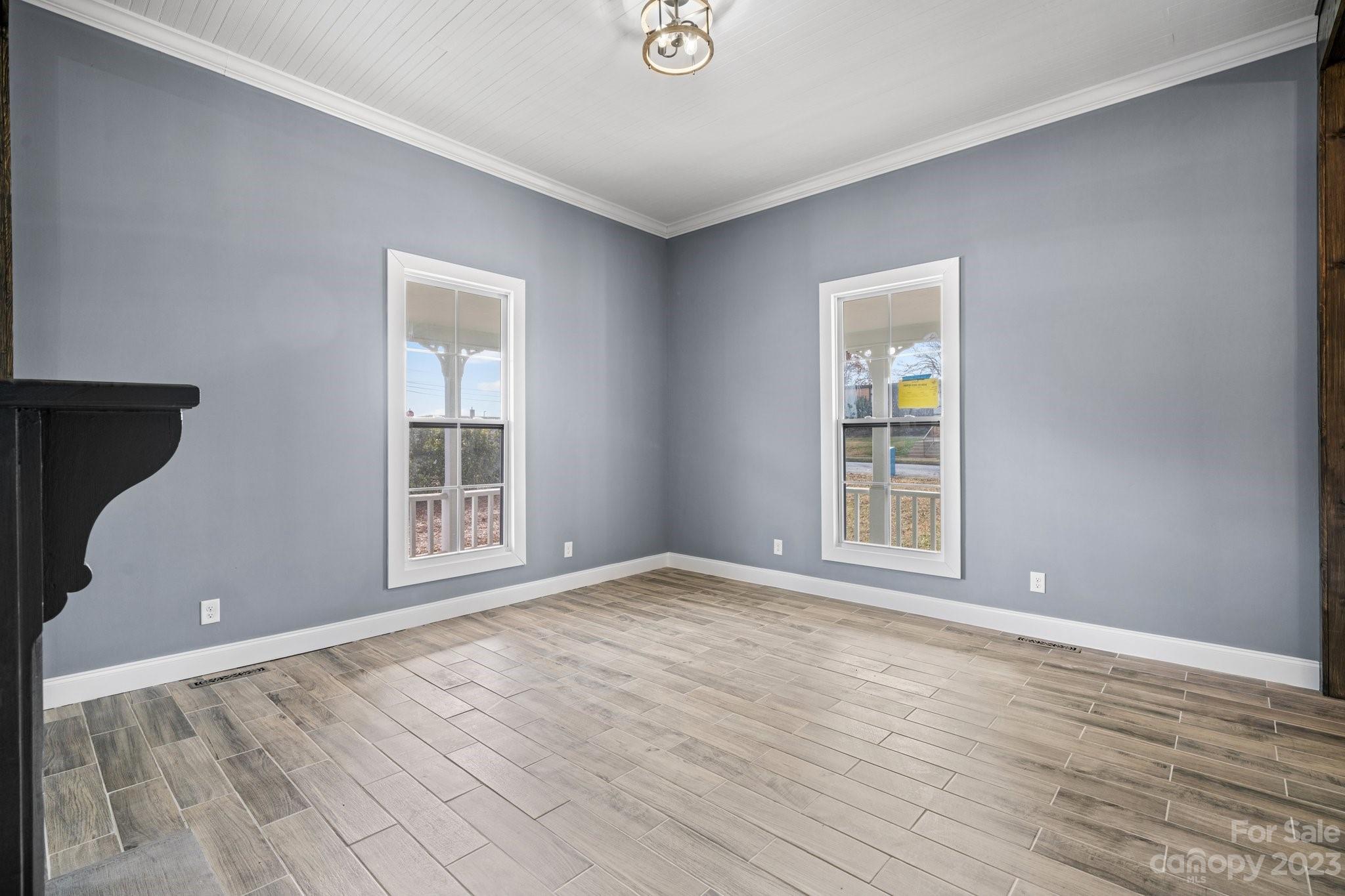 403 2nd Street Southeast Conover, NC 28613 - Photo 13 of 35 a view of an empty room with wooden floor and a window