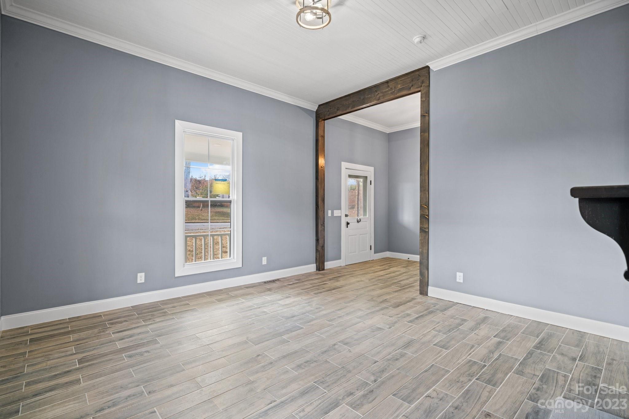 403 2nd Street Southeast Conover, NC 28613 - Photo 14 of 35 a view of an empty room with wooden floor and a window