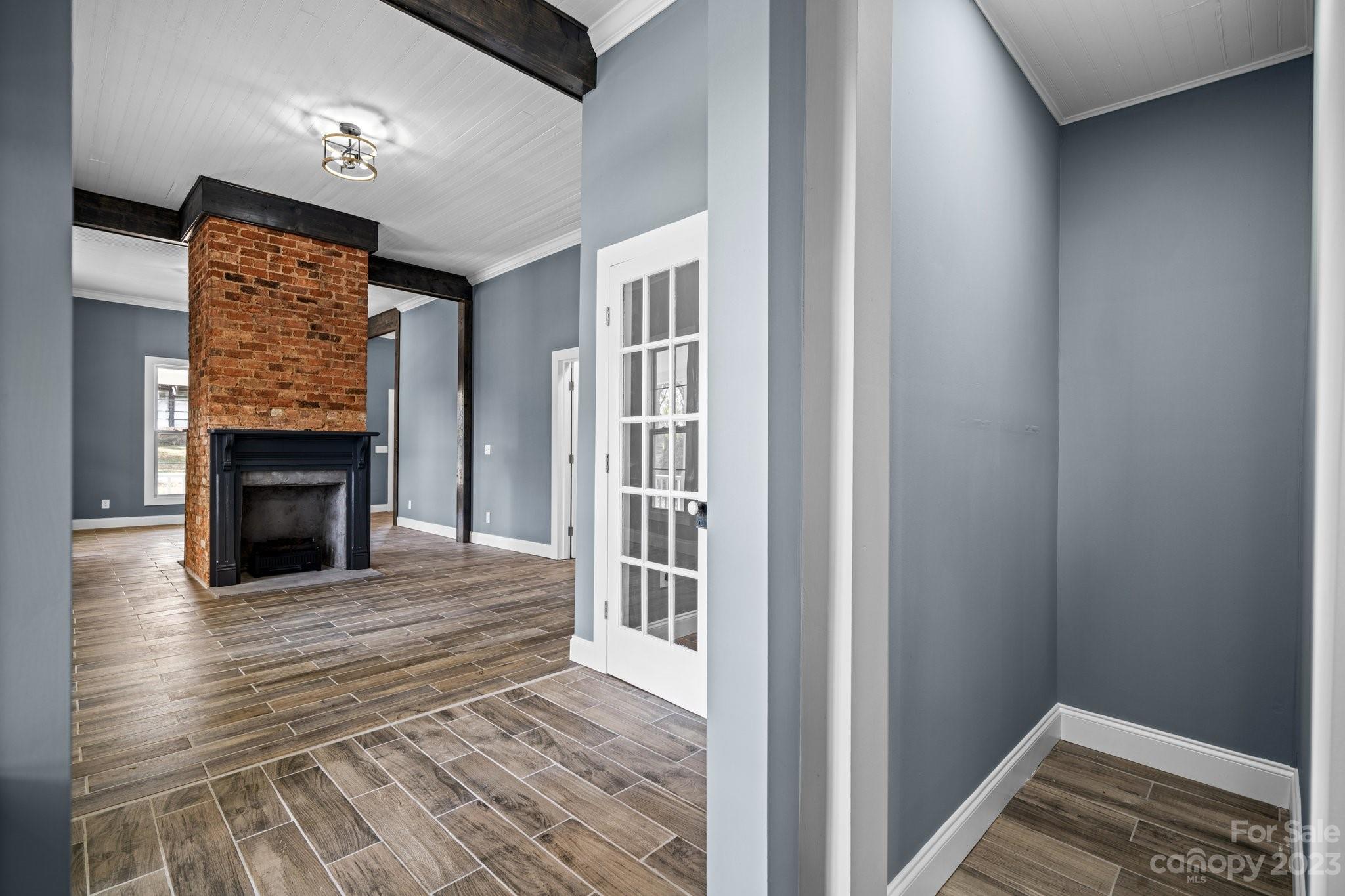 403 2nd Street Southeast Conover, NC 28613 - Photo 17 of 35 a view of a livingroom with wooden floor and a fireplace