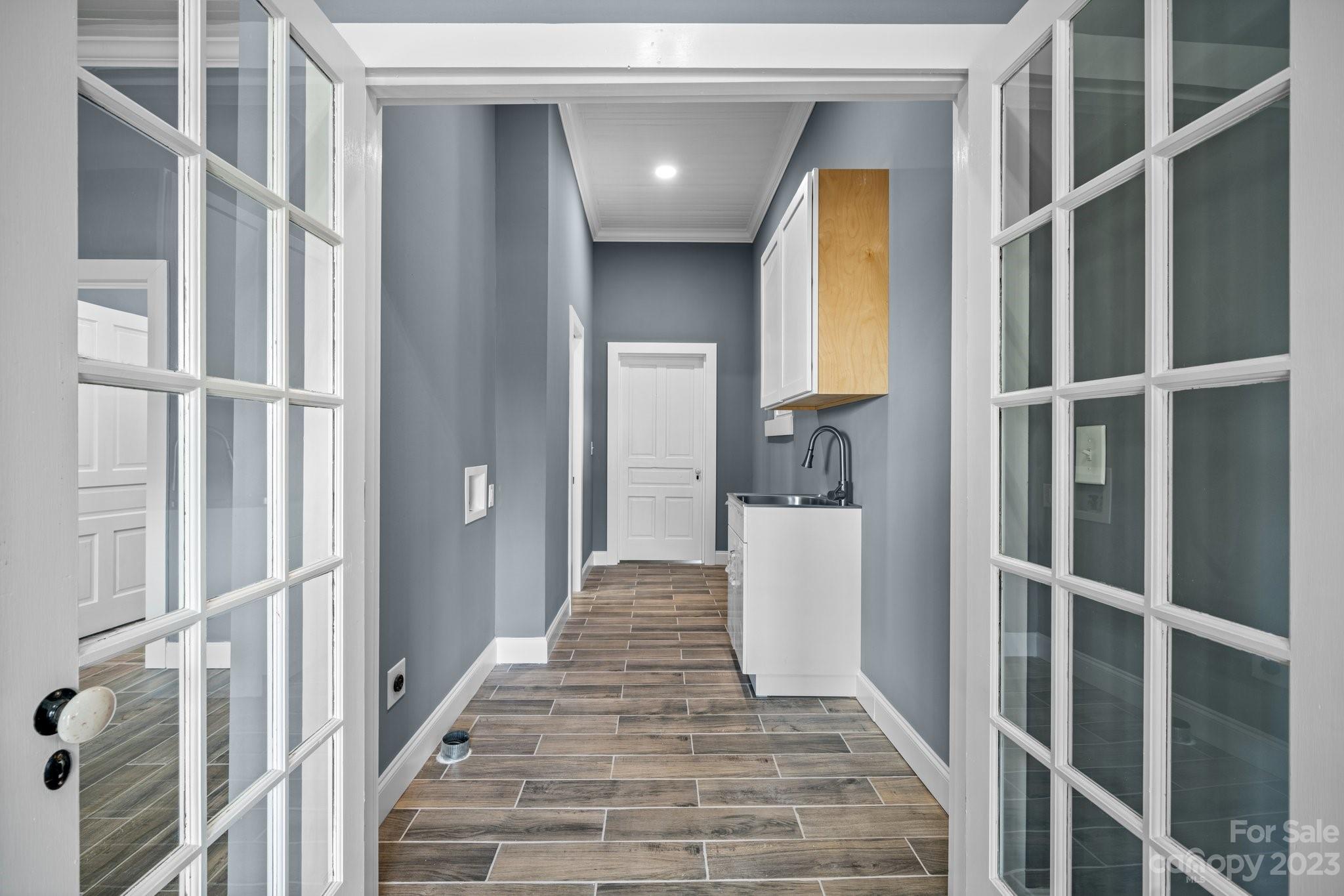 403 2nd Street Southeast Conover, NC 28613 - Photo 18 of 35 a view of a hallway with wooden floor and entryway