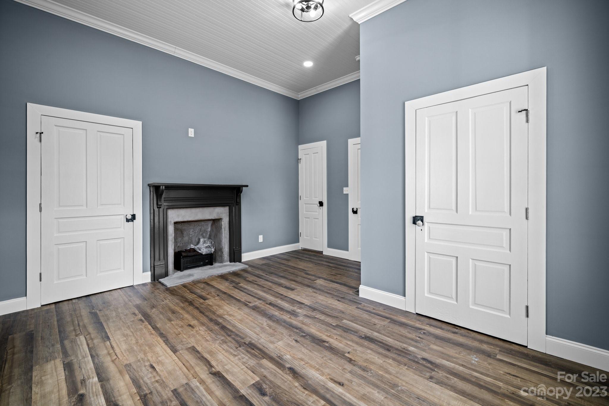 403 2nd Street Southeast Conover, NC 28613 - Photo 21 of 35 a view of empty room with wooden floor and fireplace