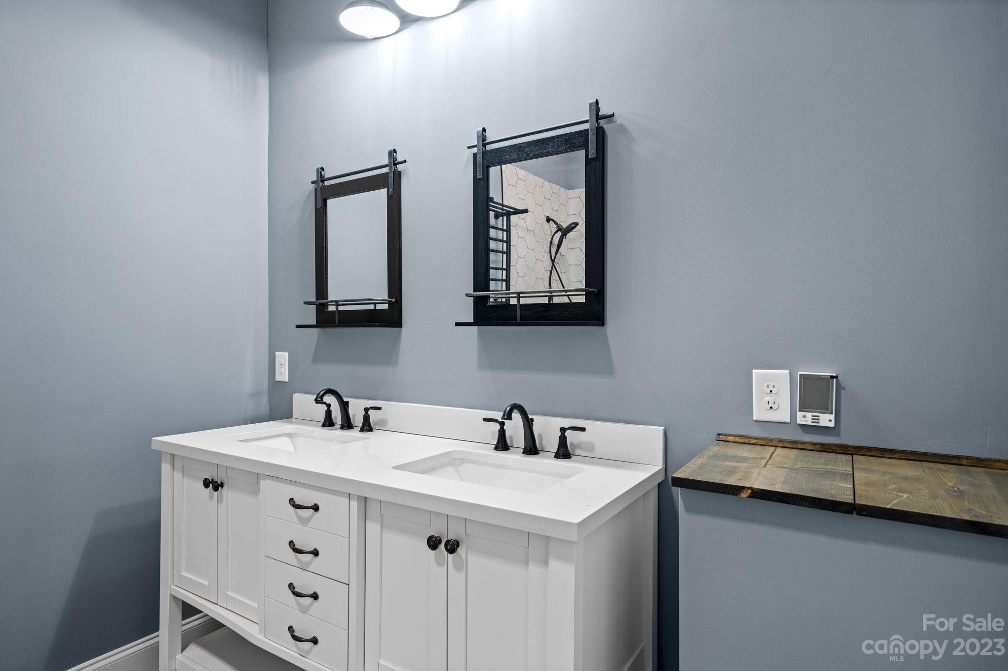 403 2nd Street Southeast Conover, NC 28613 - Photo 25 of 35 a bathroom with 2 sink and two mirror