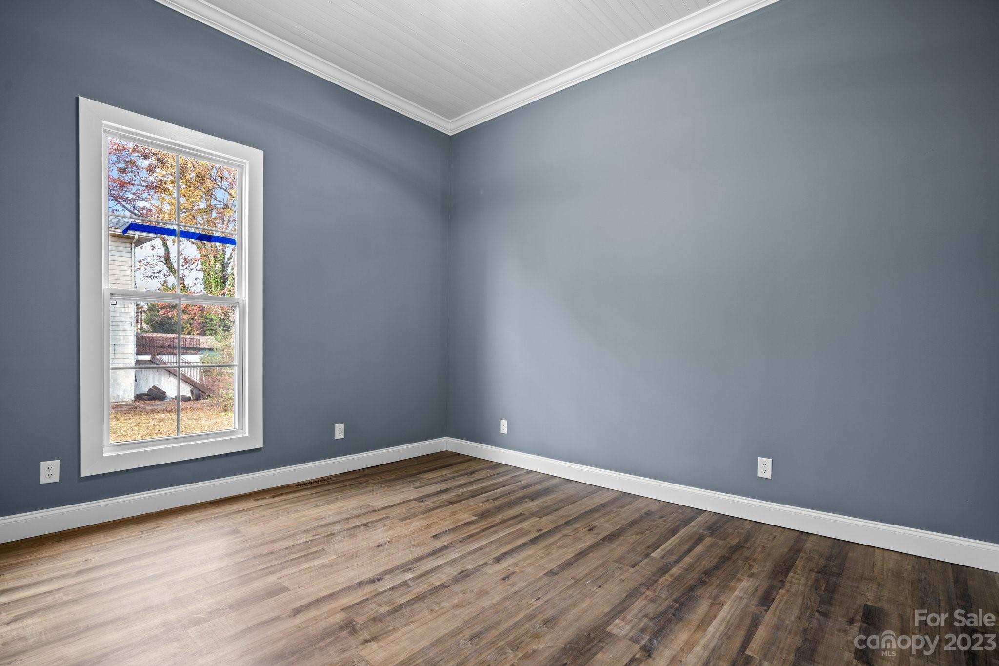 403 2nd Street Southeast Conover, NC 28613 - Photo 27 of 35 a view of an empty room with wooden floor and a window