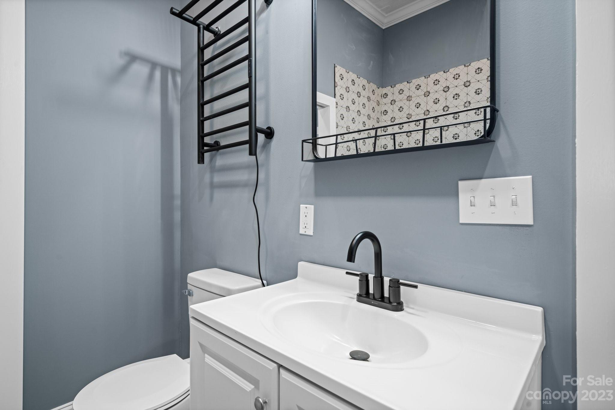 403 2nd Street Southeast Conover, NC 28613 - Photo 29 of 35 a bathroom with a sink and mirror