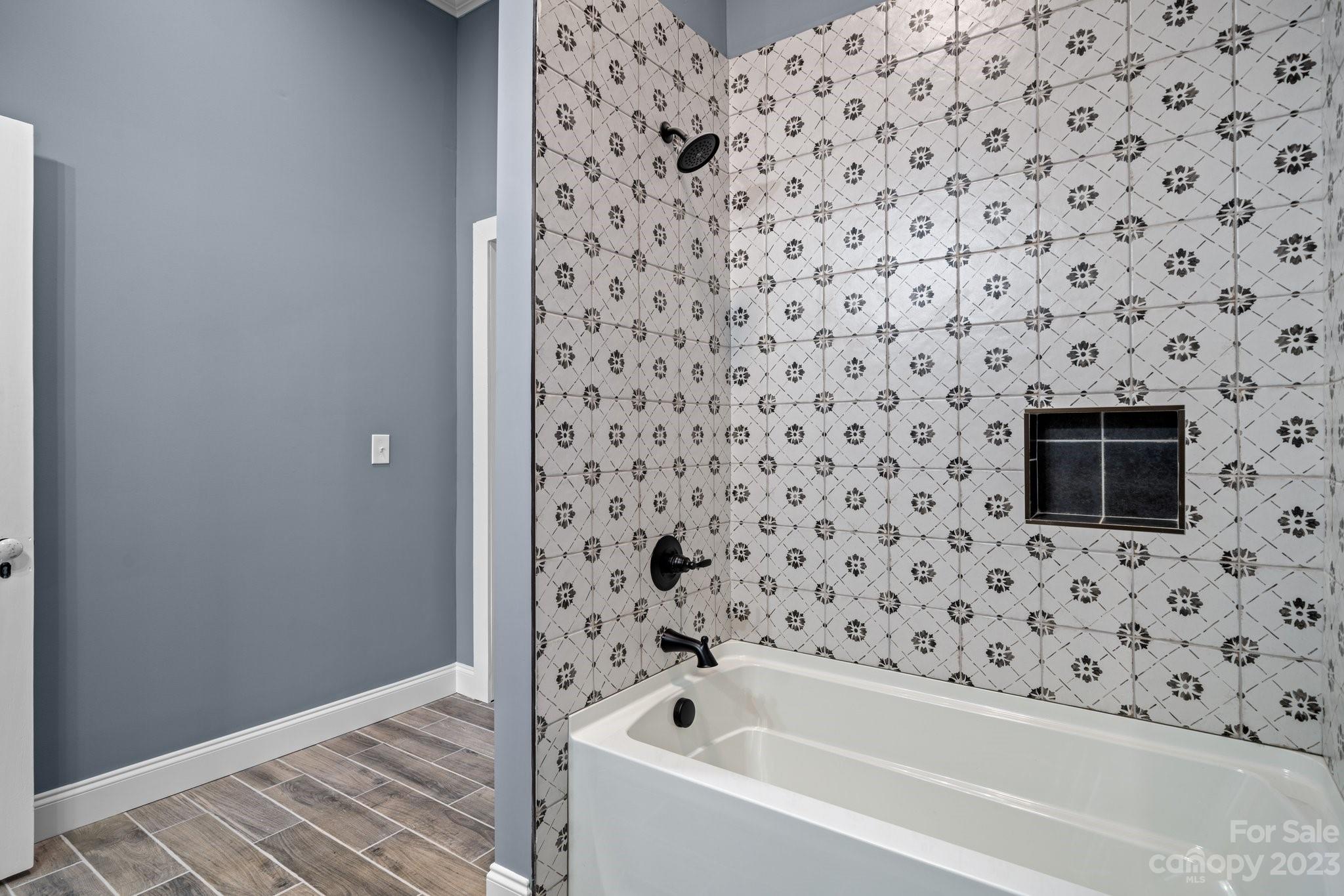403 2nd Street Southeast Conover, NC 28613 - Photo 30 of 35 a bathroom with a bathtub and a shower