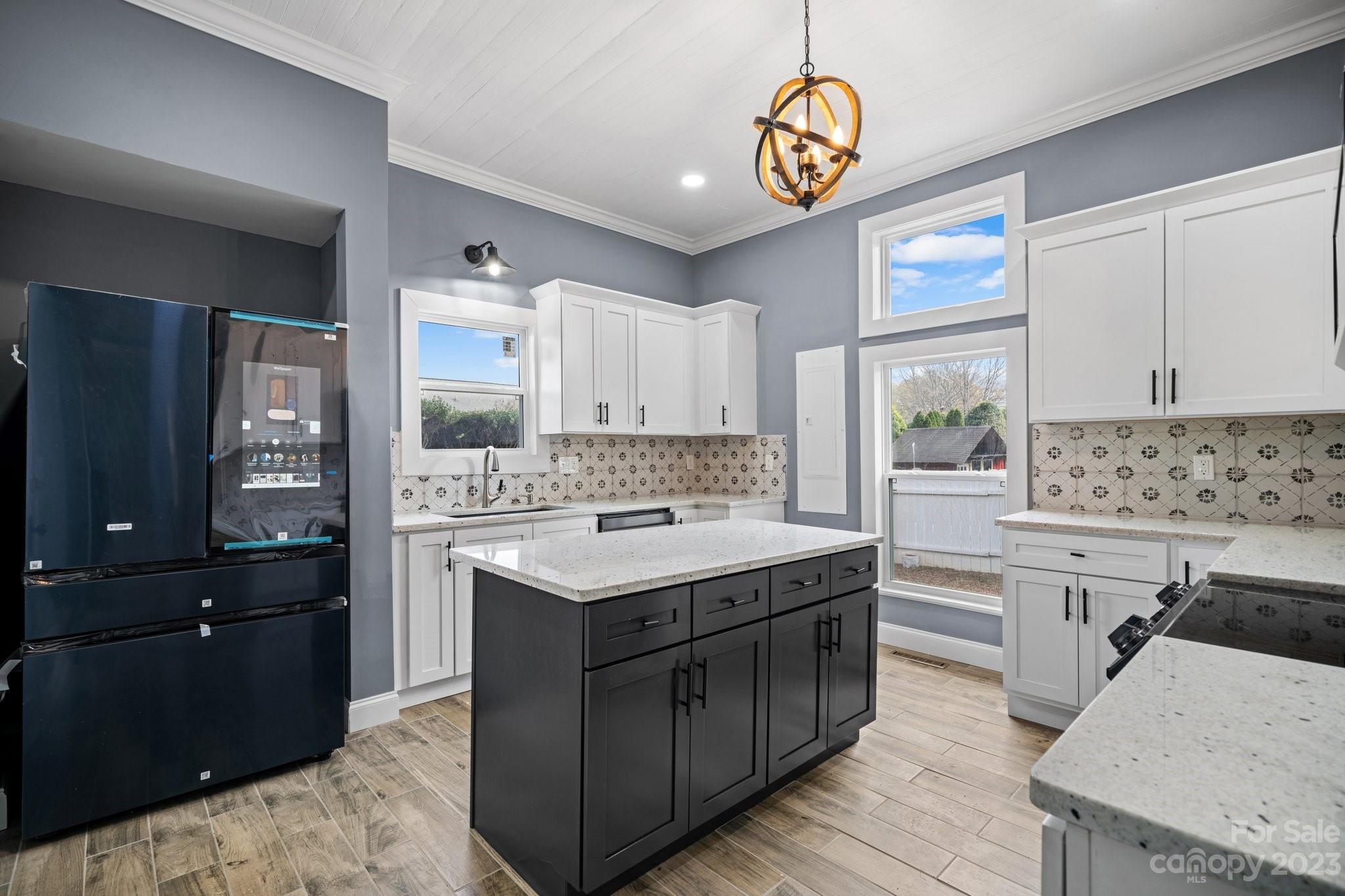 403 2nd Street Southeast Conover, NC 28613 - Photo 5 of 35 a kitchen with a sink stove and refrigerator