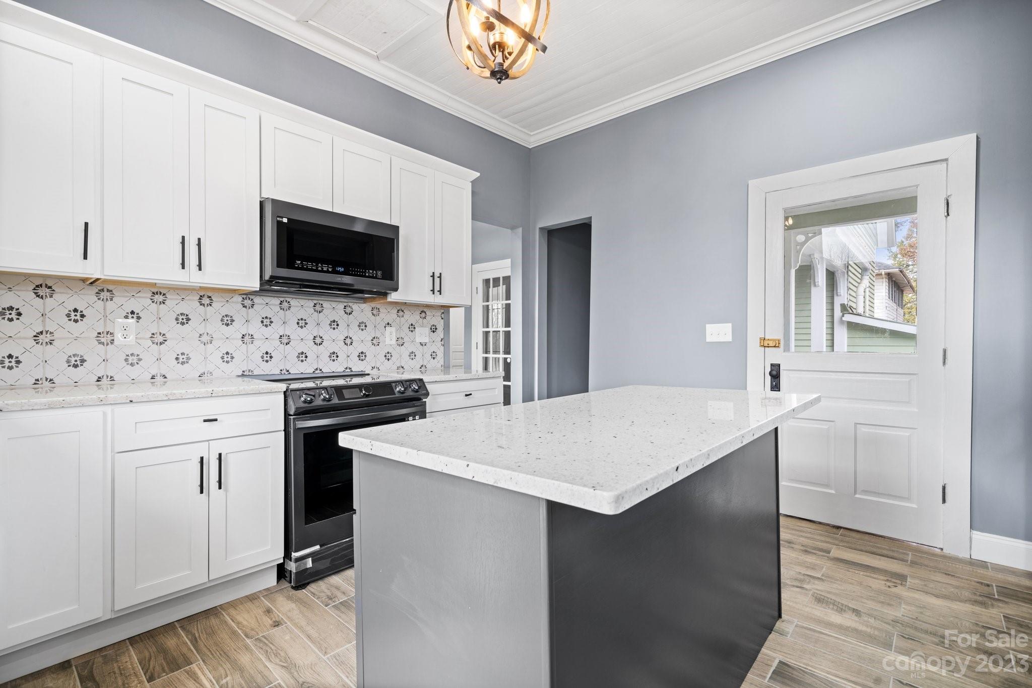 403 2nd Street Southeast Conover, NC 28613 - Photo 9 of 35 a kitchen with a sink stove and microwave