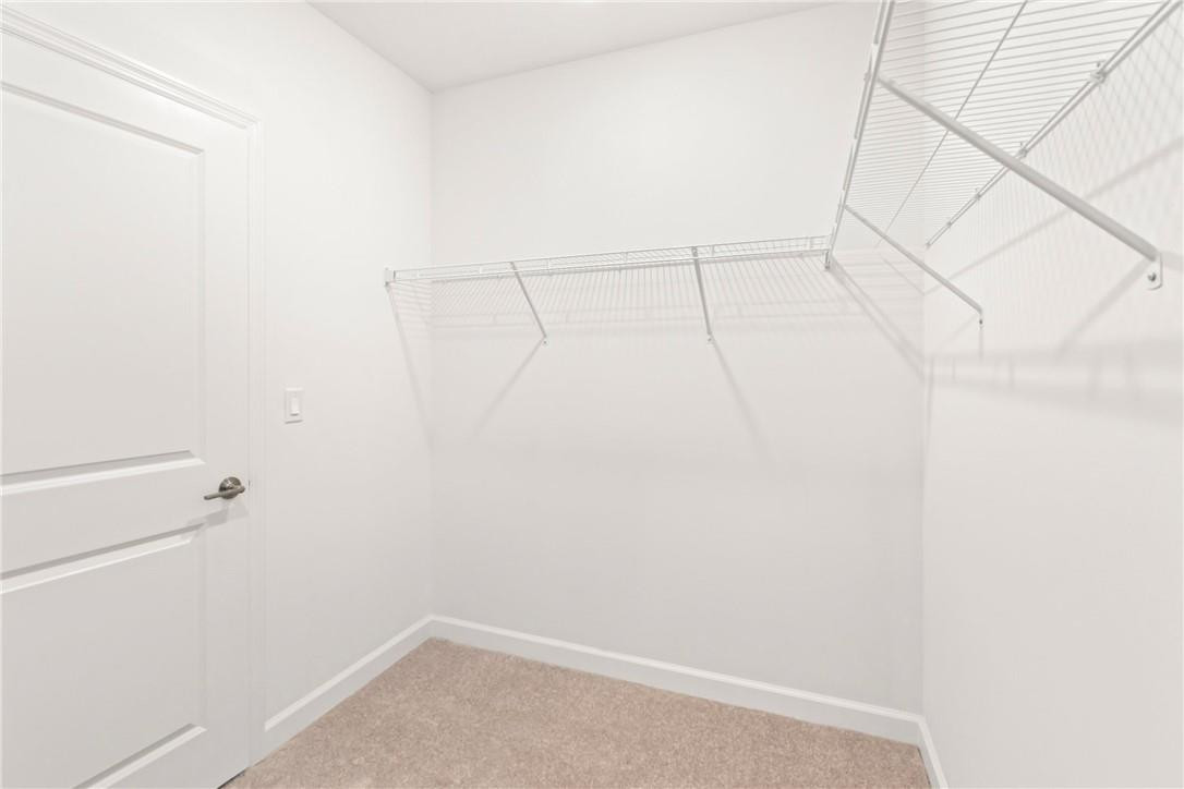 5653 Stradella Drive Boca Raton, FL 33433 - Photo 8 of 26 a view of a room with racks on the wall