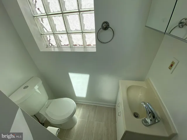 a bathroom with a toilet and a sink