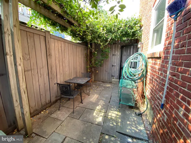 a view of a chairs with wooden fence