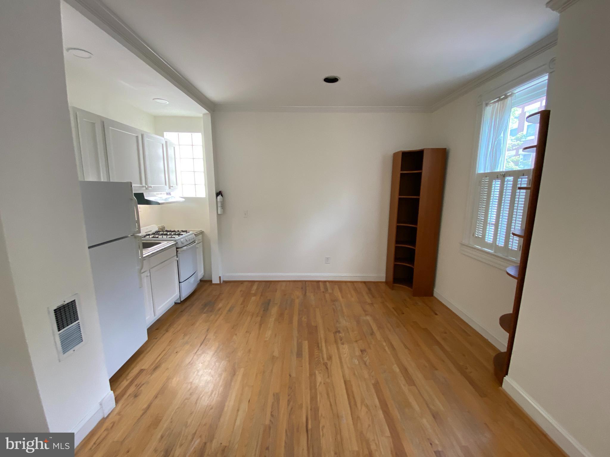 600 Acker Place Northeast Washington, DC 20002 - Photo 3 of 17 a view of empty room with wooden floor and fan