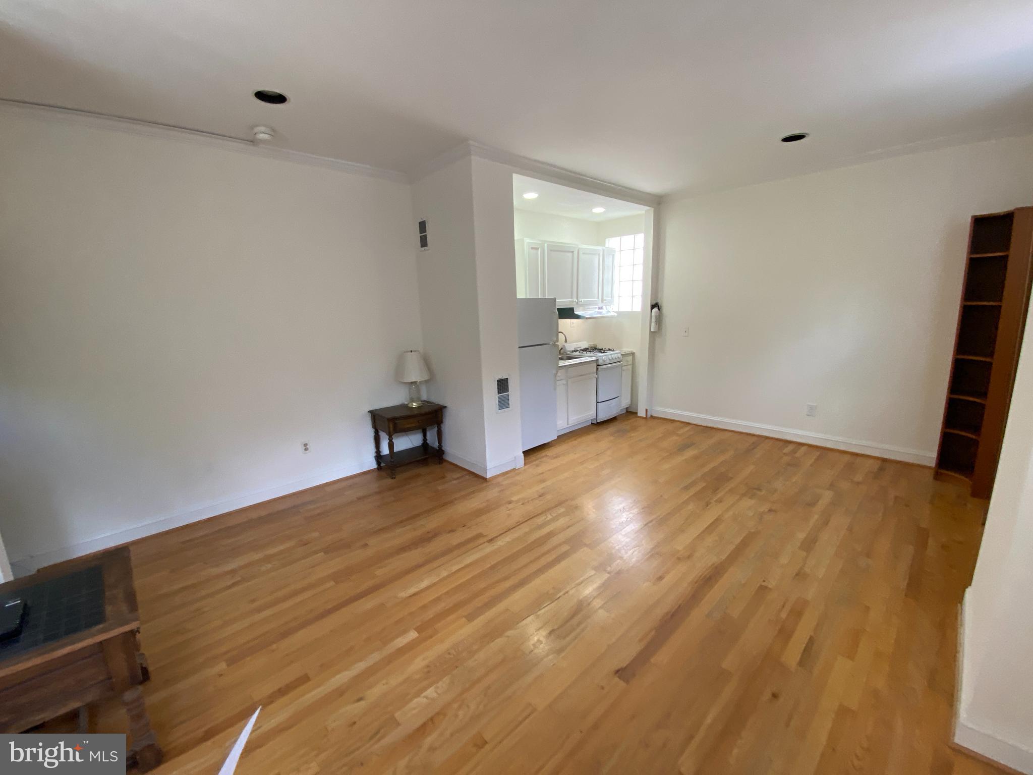 600 Acker Place Northeast Washington, DC 20002 - Photo 7 of 17 a view of empty room with wooden floor