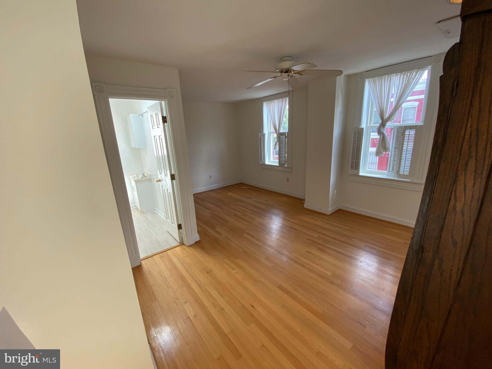 600 Acker Place Northeast Washington, DC 20002 - Photo 8 of 17 a view of hallway with window and wooden floor