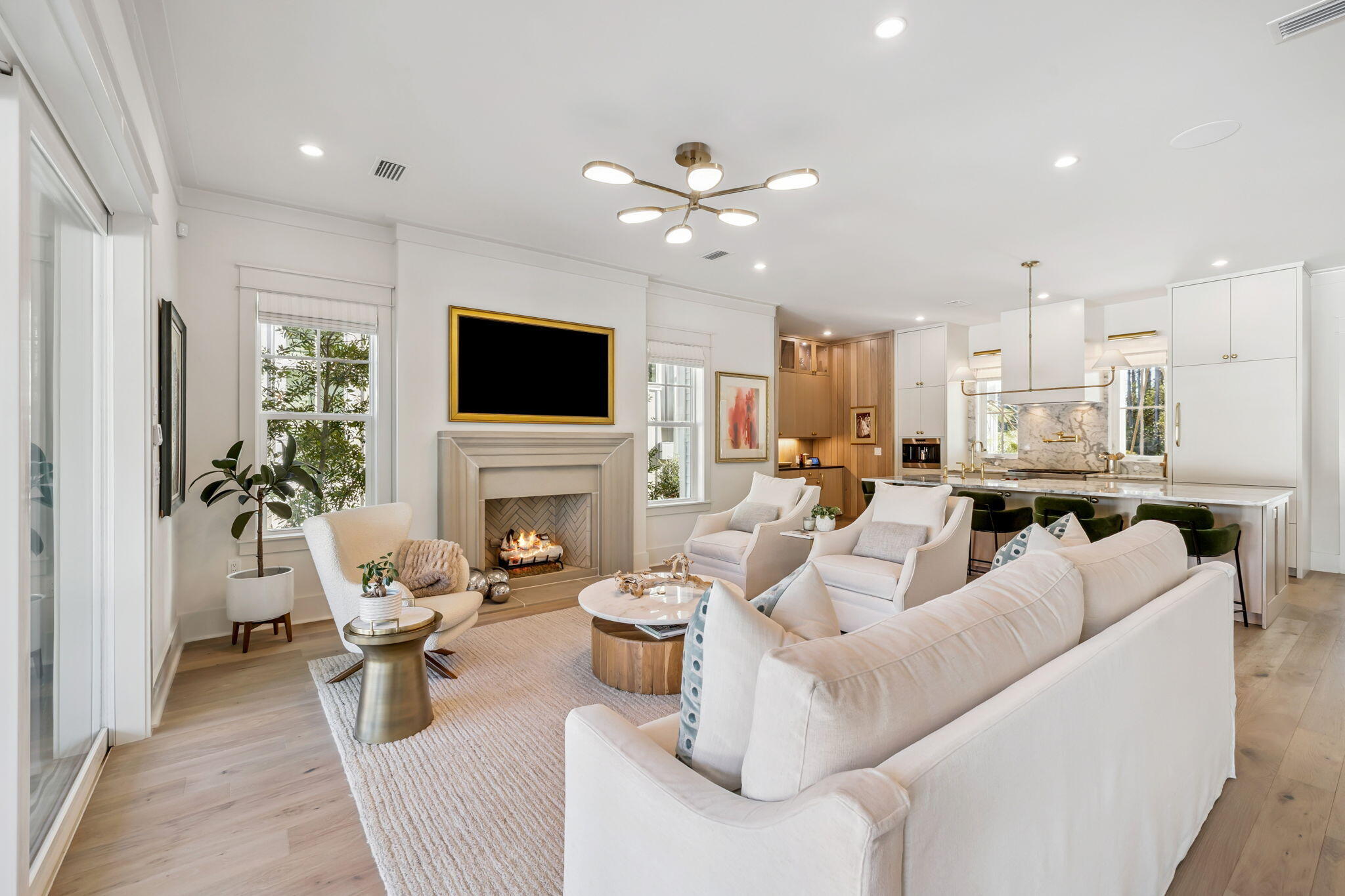 576 Cannonball Lane Watersound, FL 32461 - Photo 14 of 90 a living room with furniture a fireplace and a flat screen tv