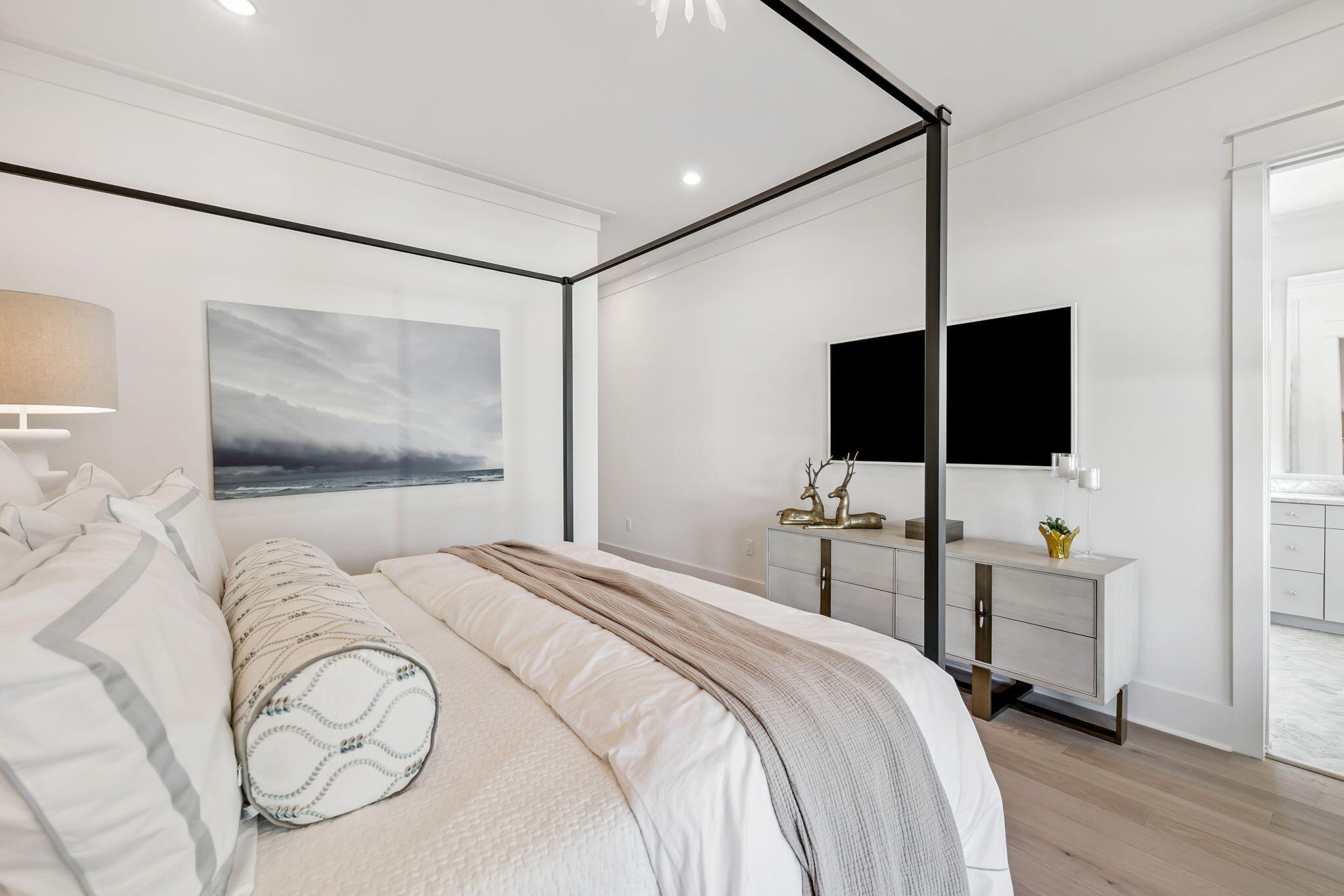 576 Cannonball Lane Watersound, FL 32461 - Photo 37 of 90 a bedroom with a bed tv and a mirror