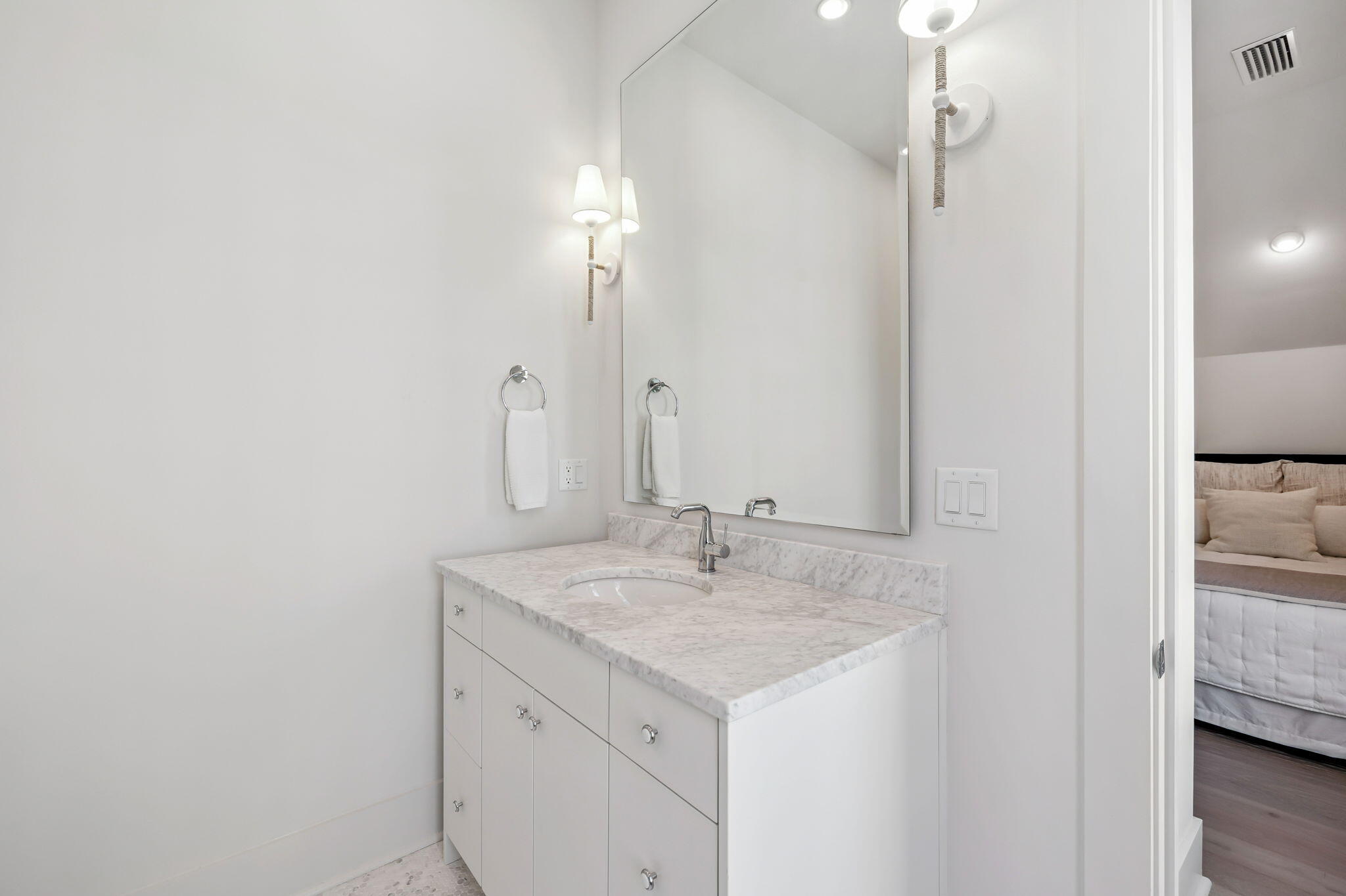 576 Cannonball Lane Watersound, FL 32461 - Photo 49 of 90 a bathroom with a sink and a mirror