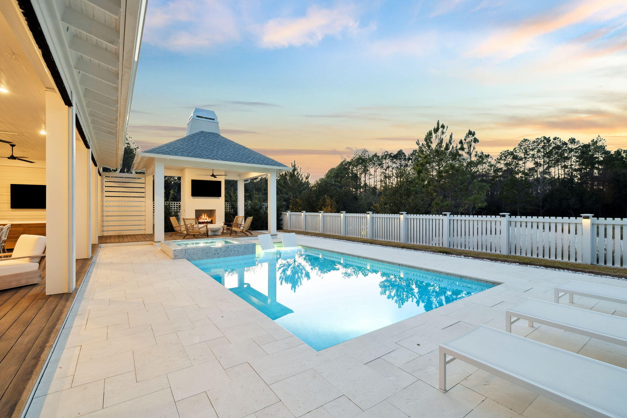 576 Cannonball Lane Watersound, FL 32461 - Photo 74 of 90 a view of a swimming pool with a lounge chair