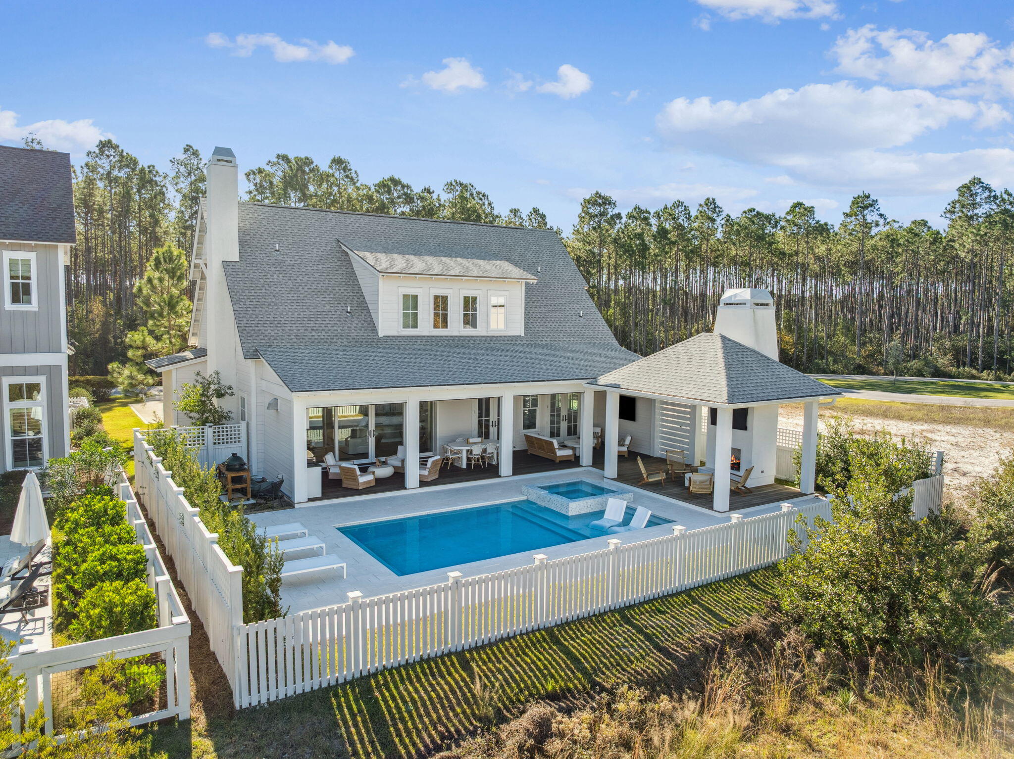 576 Cannonball Lane Watersound, FL 32461 - Photo 83 of 90 a view of a house with pool and chairs