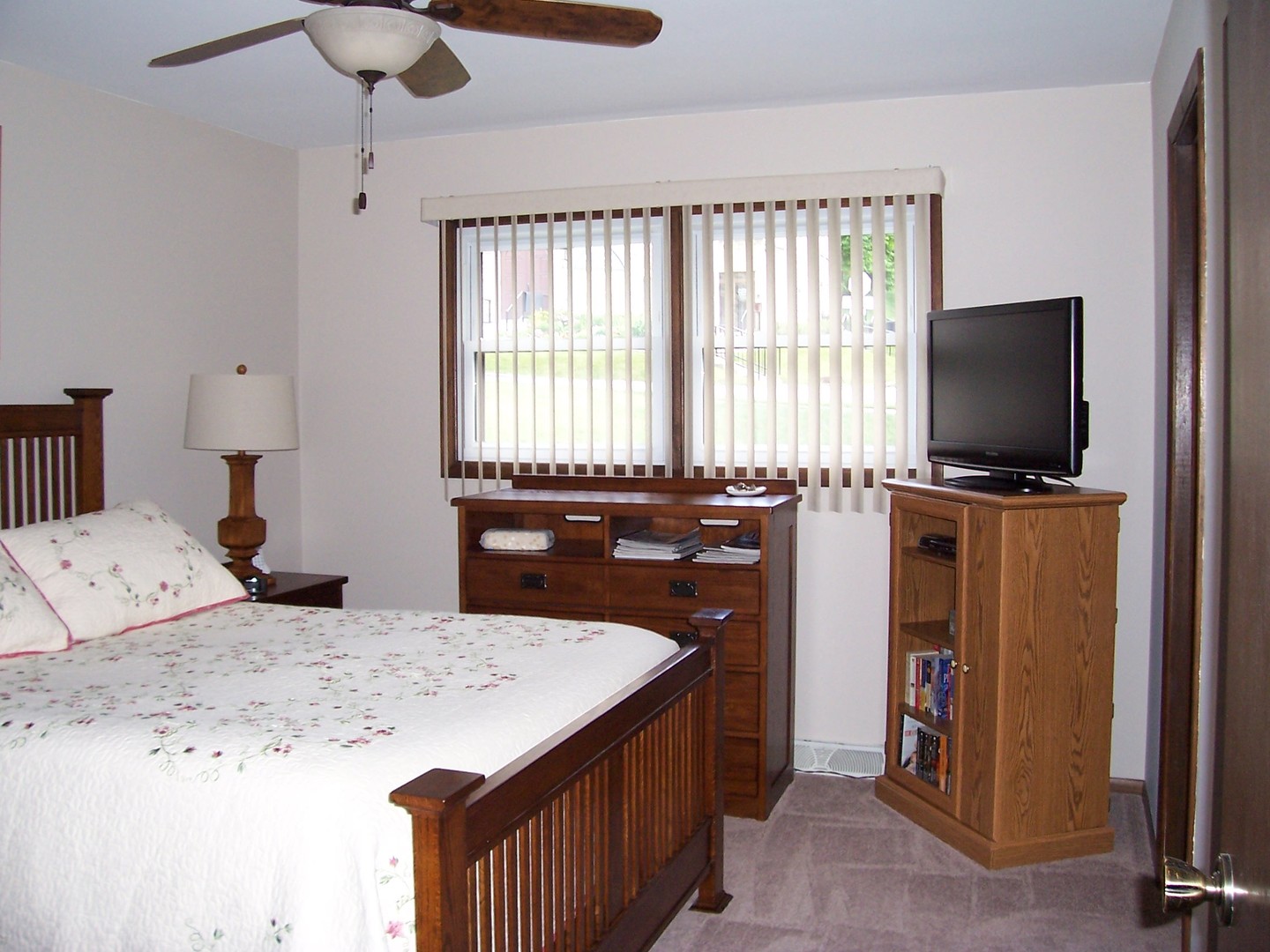 411 Lemont Street Lemont, IL 60439 - Photo 16 of 31 a bedroom with a bed and a television