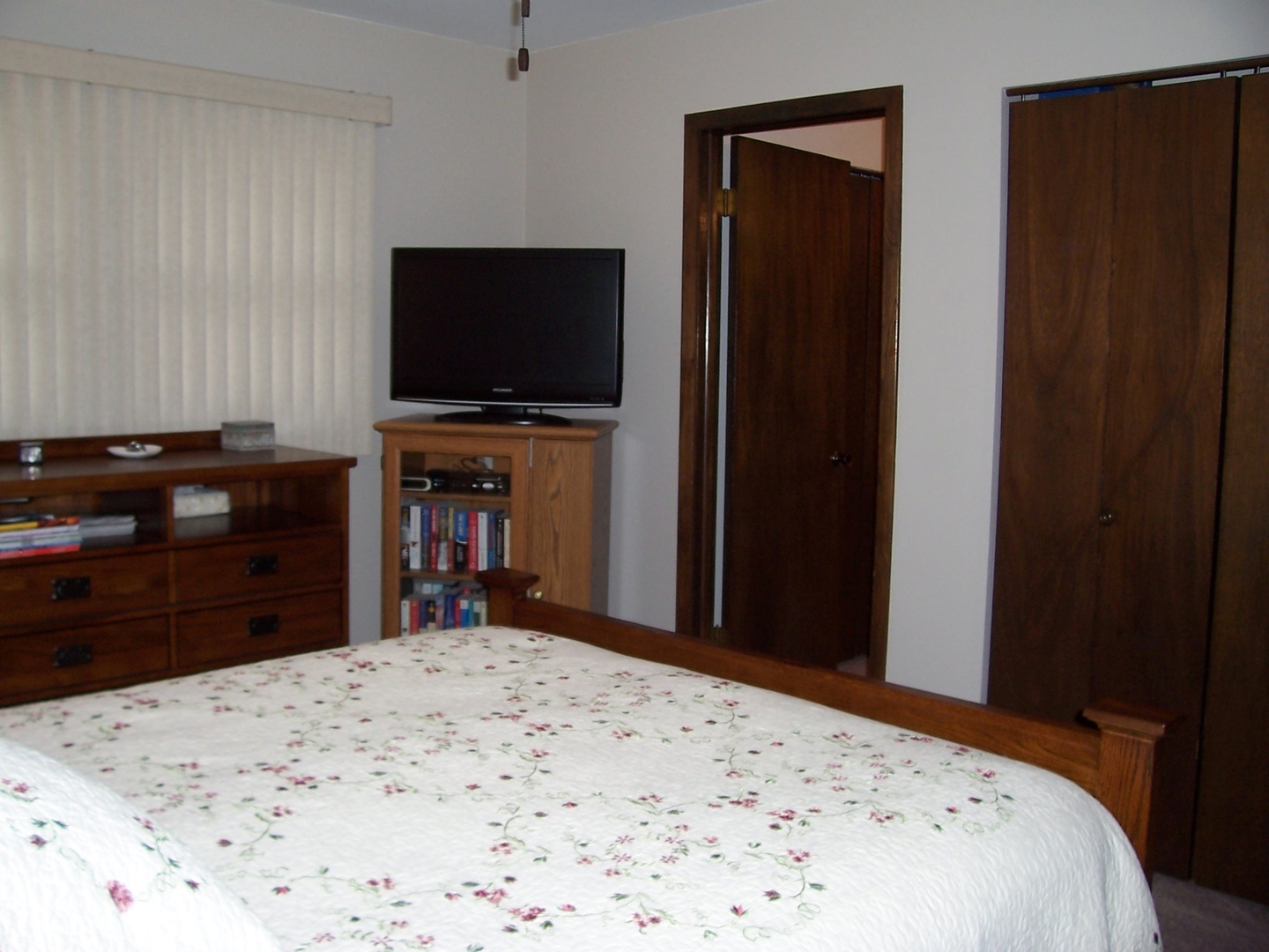 411 Lemont Street Lemont, IL 60439 - Photo 17 of 31 a bedroom with a bed and a flat screen tv